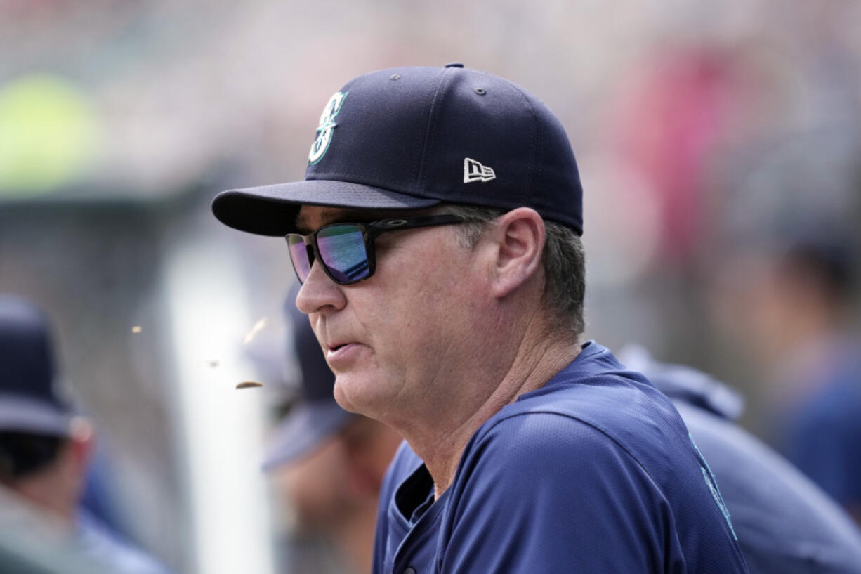 Seattle Mariners manager Scott Servais watches from the dugout during the first inning of a baseball game against the Detroit Tigers, Thursday, Aug. 15, 2024, in Detroit.