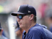 Seattle Mariners manager Scott Servais watches from the dugout during the first inning of a baseball game against the Detroit Tigers, Thursday, Aug. 15, 2024, in Detroit.