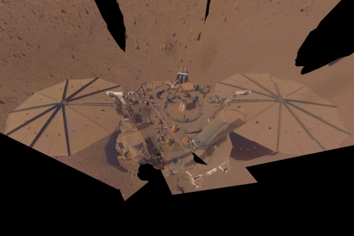 FILE - This image provided by NASA shows the InSight Mars lander in a selfie photo composite on April 24, 2022, the 1,211th Martian day, or sol, of the mission.