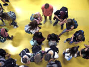 FILE - Students gather in a common area as they head to classes in Oregon, May 4, 2017.