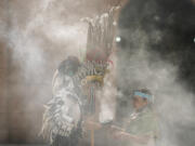 Mexica dancers burn incense during an Aug. 13 ceremony commemorating the 503rd anniversary of the fall of the Aztec empire&rsquo;s capital, Tenochtitlan, in Mexico City.