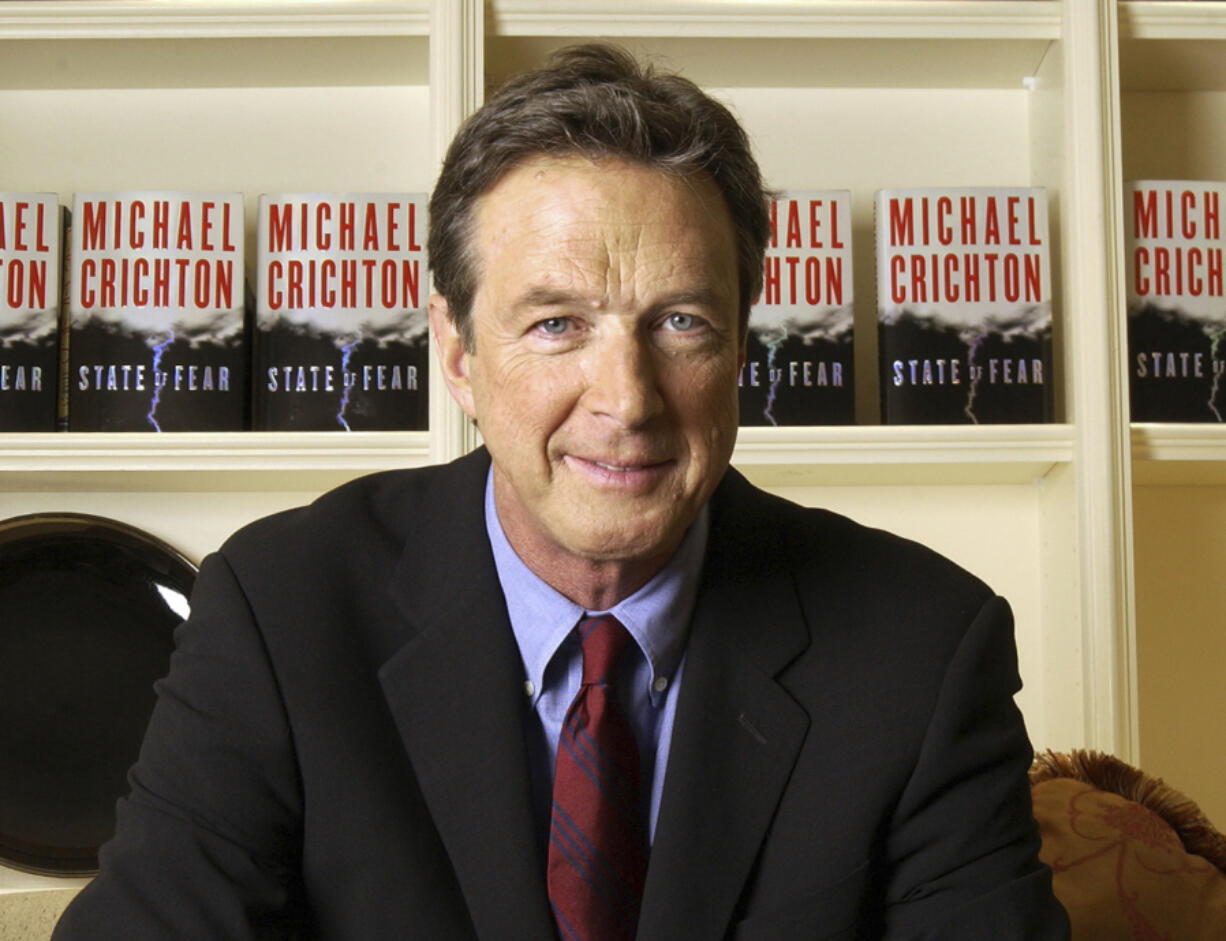 FILE - Author Michael Crichton poses for a portrait at The Peninsula Hotel in New York on Dec. 7, 2004.