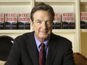 FILE - Author Michael Crichton poses for a portrait at The Peninsula Hotel in New York on Dec. 7, 2004.