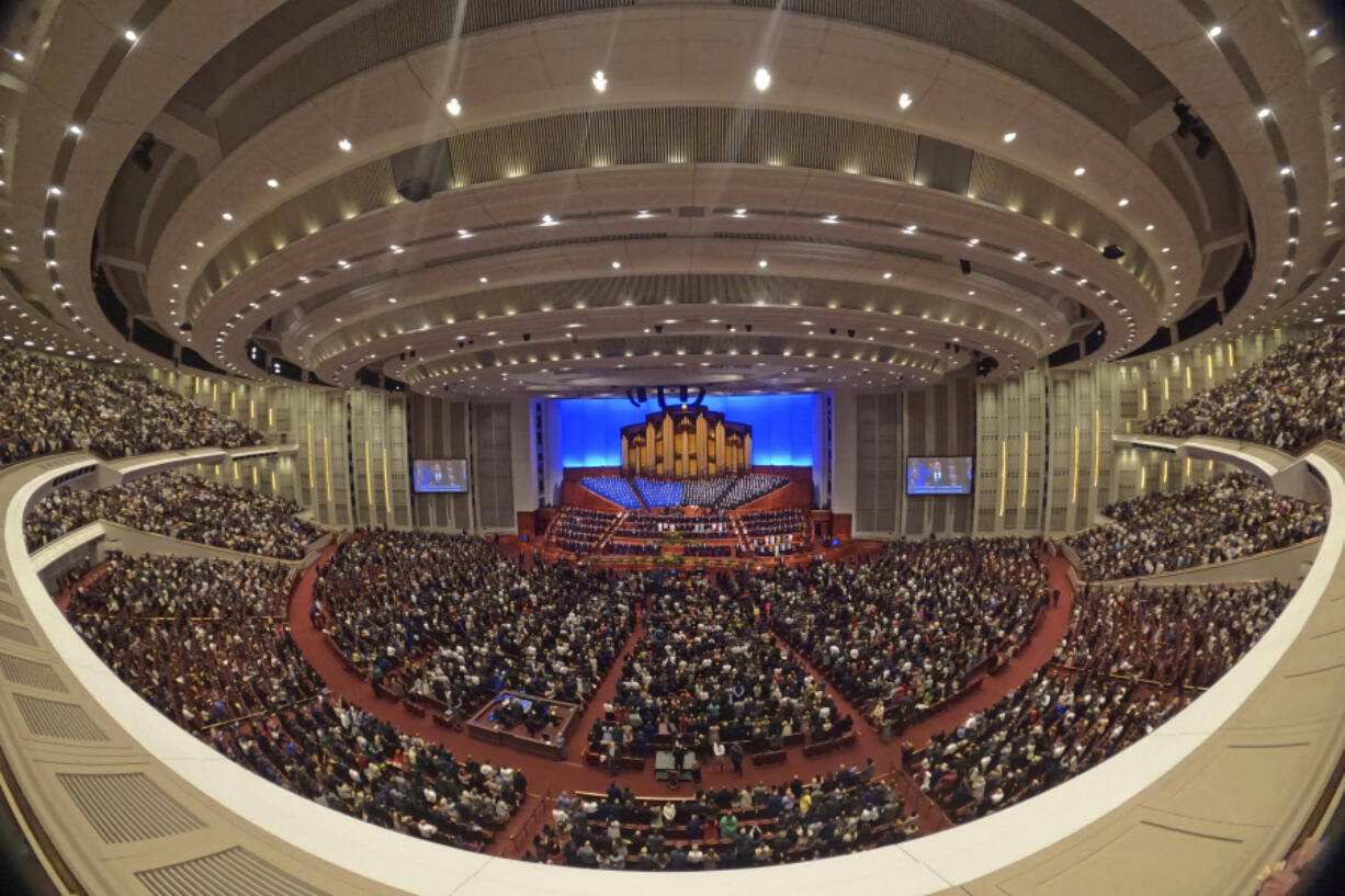 FILE - This image made with a fisheye lens shows people attending the twice-annual conference of the Church of Jesus Christ of Latter-day Saints, on April 7, 2024, in Salt Lake City.