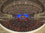 FILE - This image made with a fisheye lens shows people attending the twice-annual conference of the Church of Jesus Christ of Latter-day Saints, on April 7, 2024, in Salt Lake City.