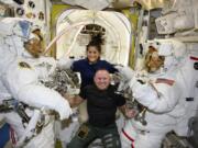 FILE - In this photo provided by NASA, Boeing Crew Flight Test astronauts Suni Williams and Butch Wilmore, center, pose with Expedition 71 Flight Engineers Mike Barratt, left, and Tracy Dyson, aboard the International Space Station&#039;s Quest airlock on June 24, 2024.