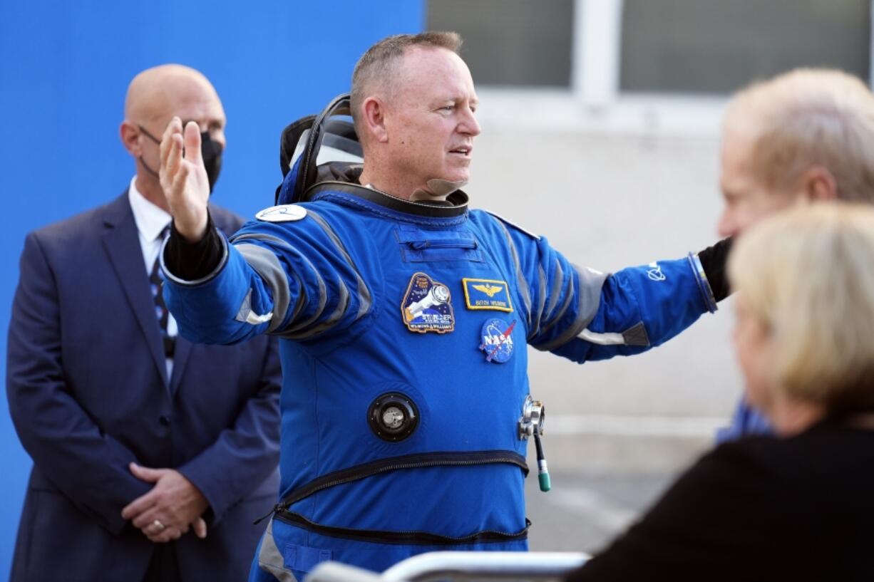 FILE - NASA astronaut Butch Wilmore gestures as he talks to family members after leaving the operations and checkout building for a trip to launch pad at Space Launch Complex 41 Wednesday, June 5, 2024, in Cape Canaveral, Fla.