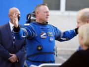 FILE - NASA astronaut Butch Wilmore gestures as he talks to family members after leaving the operations and checkout building for a trip to launch pad at Space Launch Complex 41 Wednesday, June 5, 2024, in Cape Canaveral, Fla.