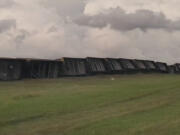 Railroad cars are knocked off the tracks due to high winds Wednesday night, near Steele, N.D., on Thursday, Aug. 29, 2024.