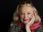 FILE - Actor Gena Rowlands poses for a portrait at the London West Hollywood hotel in West Hollywood, Calif., on Dec. 4, 2014. Rowlands, hailed as one of the greatest actors to ever practice the craft and a guiding light in independent cinema as a star in groundbreaking movies by her director husband, John Cassavetes, and later charmed audiences in her son&rsquo;s tear-jerker &ldquo;The Notebook,&rdquo; has died at age 94.