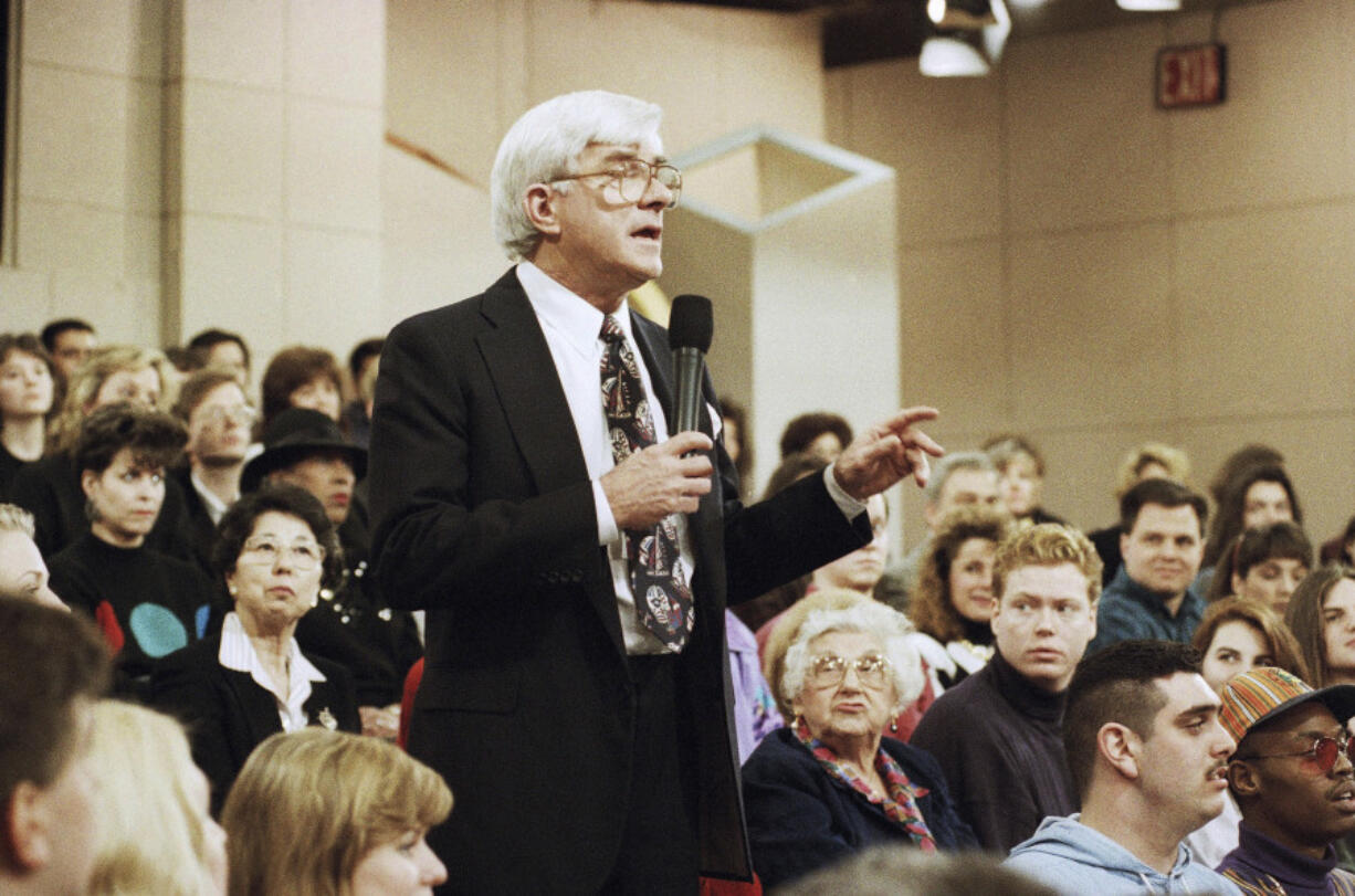 FILE - Phil Donahue hosts his television show in New York on Jan. 27, 1993. Donahue, whose pioneering daytime talk show launched an indelible television genre, has died. He was 88.