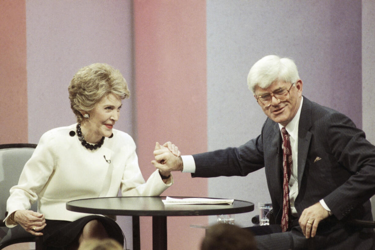 Talk show host Phil Donahue appears with former first lady Nancy Reagan during taping of his show to promote her book &ldquo;My Turn&rdquo; on Nov. 6, 1989, in Burbank, Calif. Donahue, whose pioneering daytime talk show launched an indelible television genre, died Sunday. He was 88.