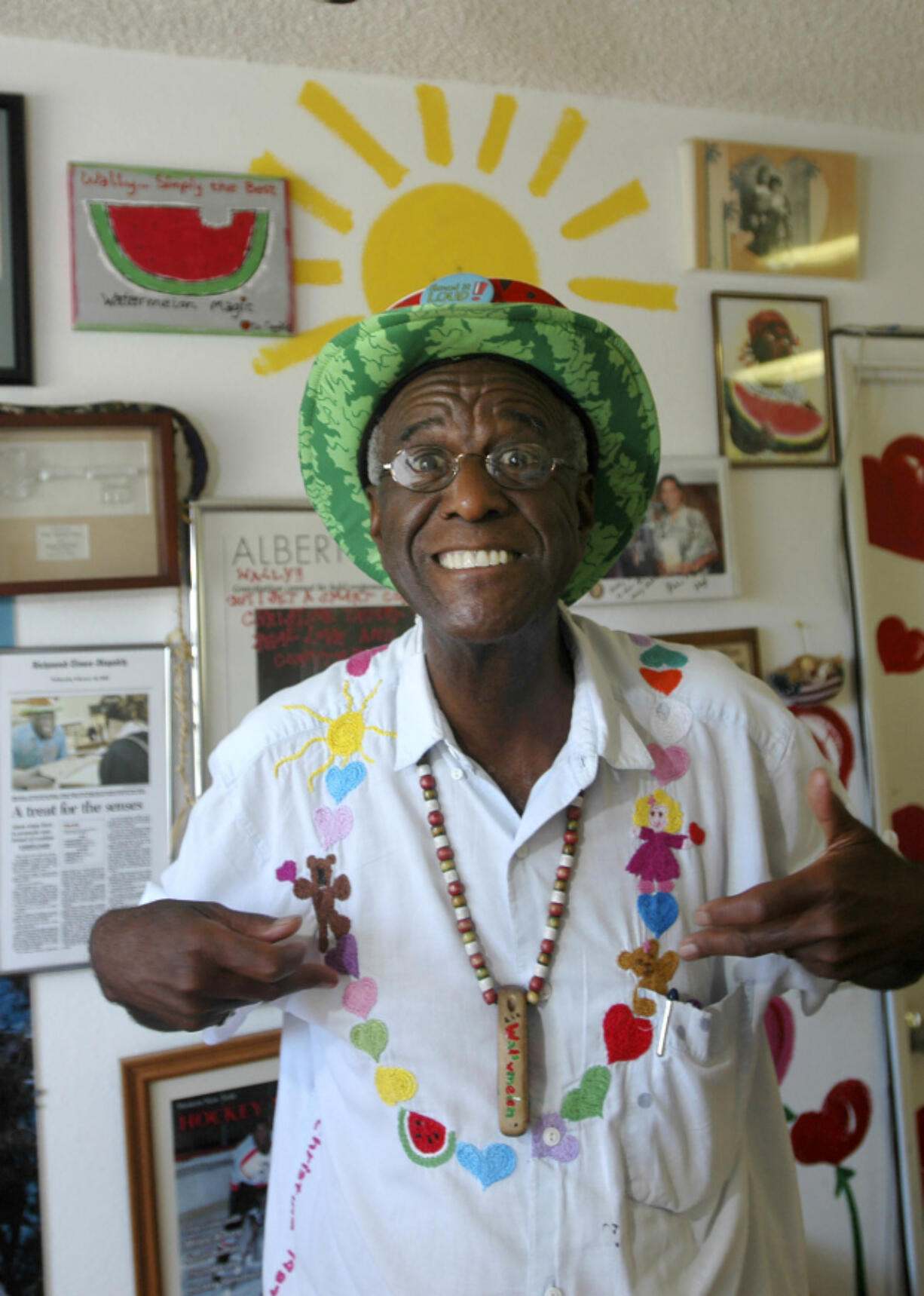 FILE - Wally Amos, of Kailua, Hawaii, is shown in his home office on June 12, 2007, in the Lanikai section of Kailua, Hawaii. Amos, the creator of the cookie empire that took his name and made it famous and who went on to become a children&rsquo;s literacy advocate, has died at age 88, on Tuesday, Aug. 13, 2024.