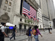 FILE - The New York Stock Exchange is shown Wednesday, July 17, 2024, in New York. In June the market suffered it&rsquo;s worst one-day drop since early 2023 and professional investors warn shakier times may be ahead given uncertainty about how quickly the Fed will cut interest rates and other big questions.