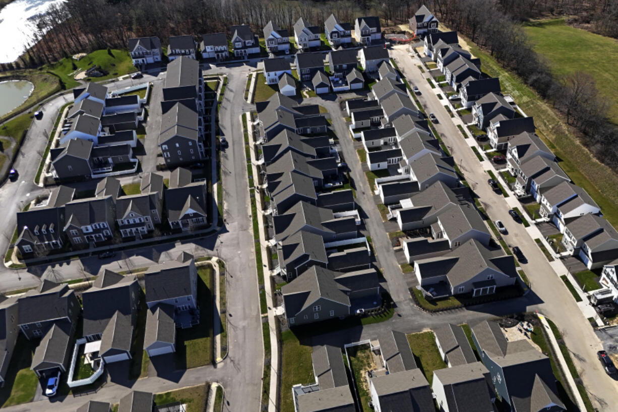 FILE - This aerial photo shows a housing development in Cranberry Township, Pa., March 29, 2024. (AP Photo/Gene J.