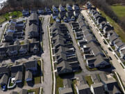 FILE - This aerial photo shows a housing development in Cranberry Township, Pa., March 29, 2024. (AP Photo/Gene J.