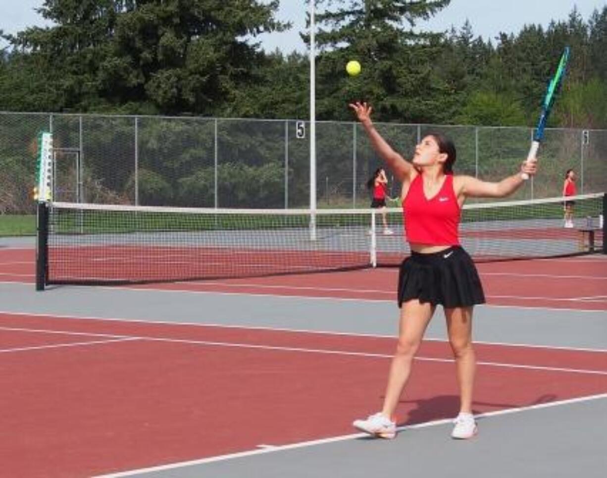 Camas High School No. 1 singles player Hailey Kerker serves during a match on the Camas tennis courts in the 2024 spring season. The high school has partnered with the United States Tennis Association Pacific Northwest Section to work on a plan to put a bubble over the eight courts at the high school in order to have year-round play for the high school teams and the community as well.