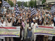 Supporters of political party Jamiat Ulema-e-Islam, chant slogans during a protest to condemn the killing of Hamas leader Ismail Haniyeh, who was killed in an assassination in Tehran, in Karachi, Pakistan, Friday, Aug. 2, 2024.