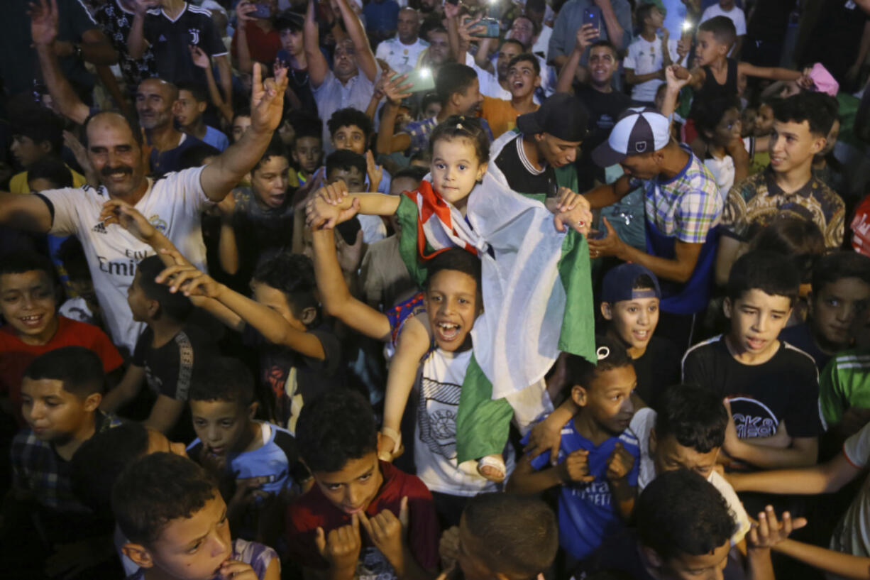 Supporters and relatives watch Algerian boxer Imane Khelif competing in the women&rsquo;s 66-kg boxing Olympic final match in Bibane Mesbah, near Tiaret, Algeria, Friday , Aug. 9, 2024.