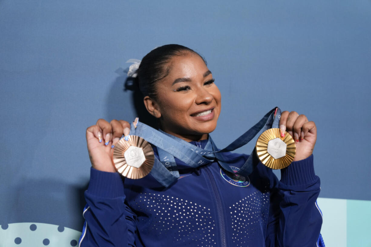 Jordan Chiles, of the United States, holds up her medals after the women&rsquo;s artistic gymnastics individual apparatus finals Bercy Arena at the 2024 Summer Olympics, Monday, Aug. 5, 2024, in Paris, France.