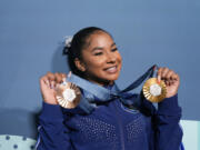 Jordan Chiles, of the United States, holds up her medals after the women&rsquo;s artistic gymnastics individual apparatus finals Bercy Arena at the 2024 Summer Olympics, Monday, Aug. 5, 2024, in Paris, France.