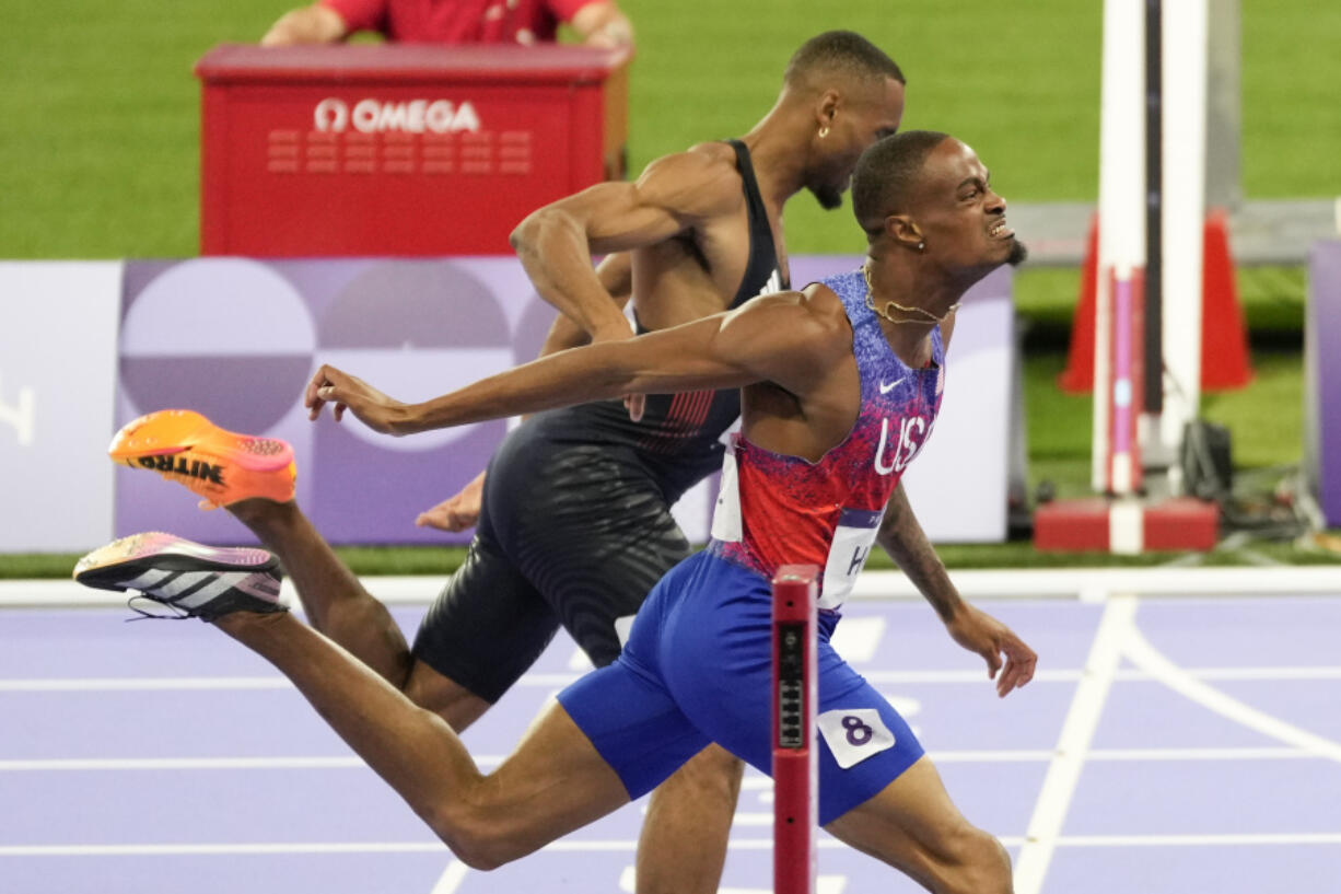 Quincy Hall, of the United States, crosses the finish line followed by Matthew Hudson-Smith, of Britain, in the men&rsquo;s 400-meters final at the 2024 Summer Olympics, Wednesday, Aug. 7, 2024, in Saint-Denis, France.