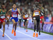 Joshua Cheptegei, of Uganda, celebrates after winning the wins the men&rsquo;s 10,000-meter final at the 2024 Summer Olympics, Friday, Aug. 2, 2024, in Saint-Denis, France.