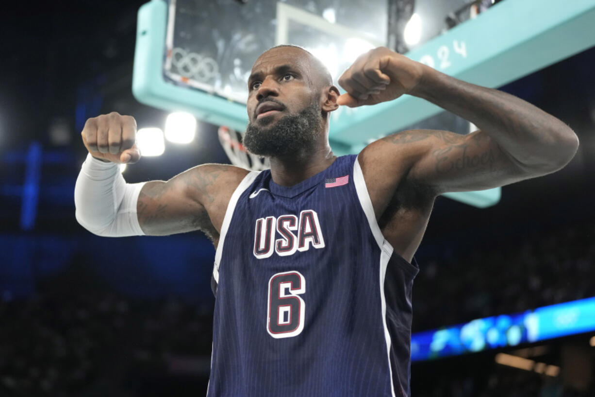 United States&rsquo; LeBron James flexes after scoring during a men&rsquo;s basketball game against Brazil at the 2024 Summer Olympics, Tuesday, Aug. 6, 2024, in Paris, France.