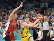 Australia&rsquo;s Sami Whitcomb, right, drives toward the basket as Canada&rsquo;s Kia Nurse defends during a women&rsquo;s basketball game at the 2024 Summer Olympics, Thursday, Aug. 1, 2024, in Villeneuve-d&rsquo;Ascq, France.