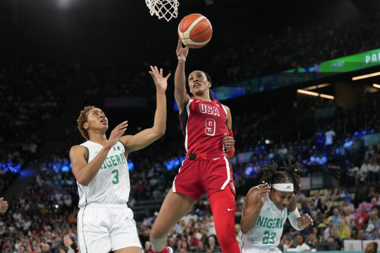 United States&rsquo; A&rsquo;ja Wilson (9) shoots between Pallas Kunayi Akpanah (3) and Ezinne Kalu (23), of Nigeria, during a women&rsquo;s quarterfinal game at Bercy Arena at the 2024 Summer Olympics, Wednesday, Aug. 7, 2024, in Paris, France. (AP Photo/Mark J.