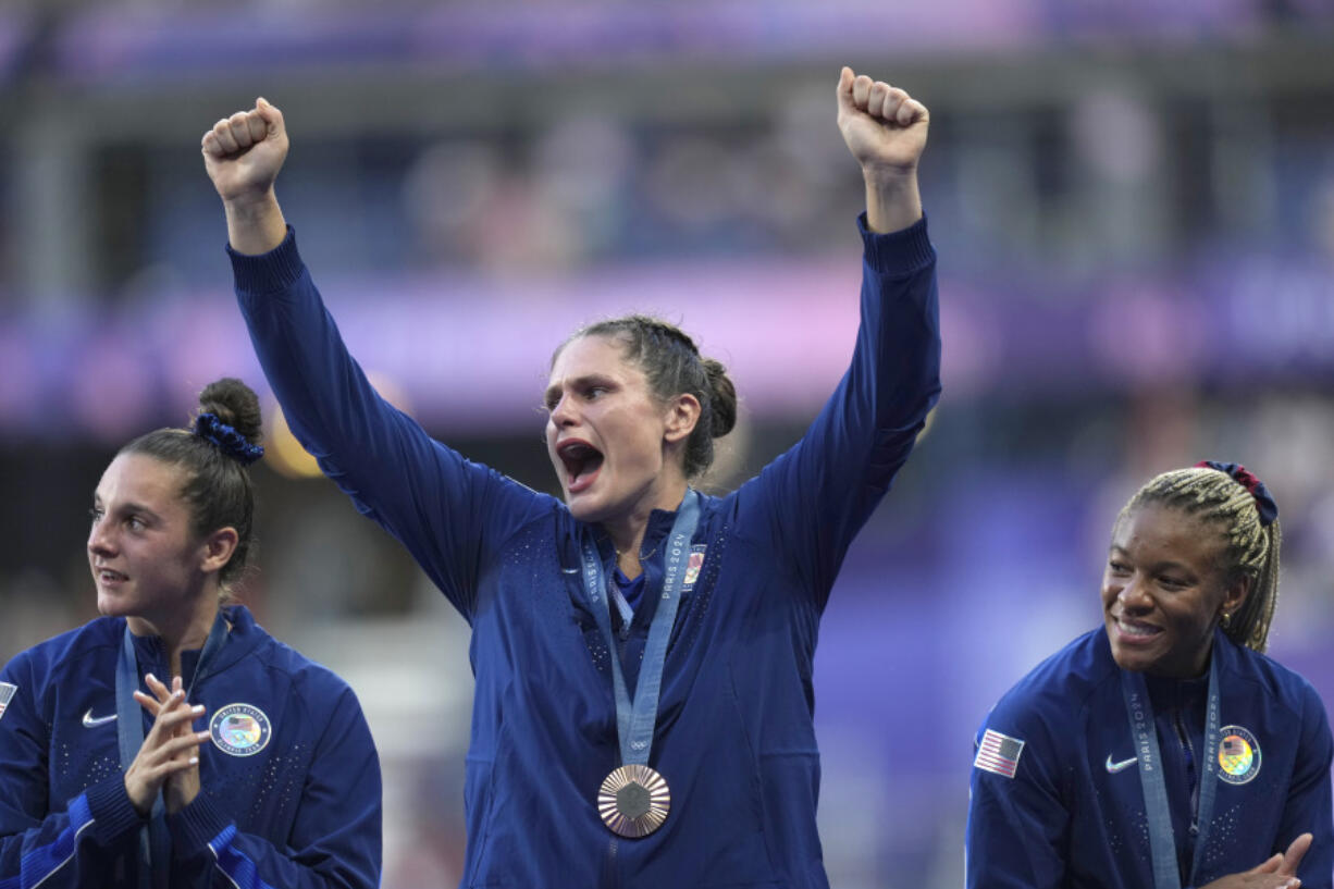 United States&#039; Ilona Maher, centre reacts as she stands on the podium with her bronze medal during the presentation ceremony Rugby Sevens at the 2024 Summer Olympics, in the Stade de France, in Saint-Denis, France, Tuesday, July 30, 2024.