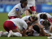 United States&rsquo; Sophia Smith celebrates with team mates the opening goal during a women&rsquo;s semifinal soccer match between the United States and Germany at the 2024 Summer Olympics, Tuesday, Aug. 6, 2024, at Lyon Stadium in Decines, France.