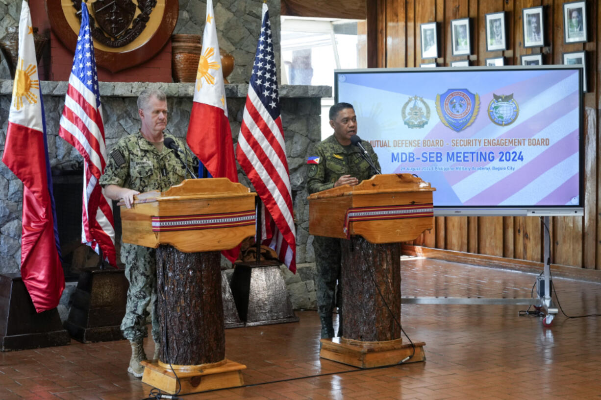 U.S. Indo-Pacific Command Commander Admiral Samuel Paparo, left, and Philippines military chief Gen. Romeo Brawner Jr.,answer questions during a press conference on the Mutual Defense Board-Security Engagement Board held at the Philippine Military Academy in Baguio, northern Philippines on Thursday, Aug. 29, 2024.