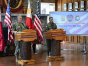 U.S. Indo-Pacific Command Commander Admiral Samuel Paparo, left, and Philippines military chief Gen. Romeo Brawner Jr.,answer questions during a press conference on the Mutual Defense Board-Security Engagement Board held at the Philippine Military Academy in Baguio, northern Philippines on Thursday, Aug. 29, 2024.