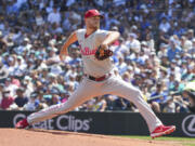 Philadelphia Phillies pitcher Zack Wheeler steps to throw a pitch during the first inning of a baseball game, Sunday, Aug. 4, 2024, in Seattle.