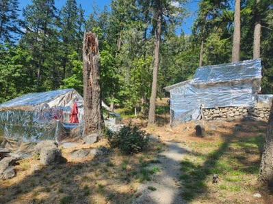 Around the community of Stehekin, firefighters have been working on community protection measures. These measures include working on firelines around the community including clearing brush and leaf litter as well as felling standing dead trees that could fall across the fireline. Water pumps with hoselays and sprinklers are being set up throughout the community to further protect structures and the fireline.