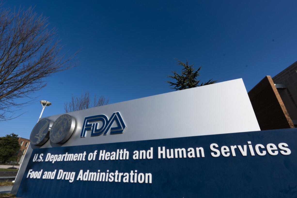 FILE- A sign is displayed for the Food and Drug Administration offices in Silver Spring, Md., on Dec. 10, 2020.