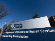 FILE- A sign is displayed for the Food and Drug Administration offices in Silver Spring, Md., on Dec. 10, 2020.