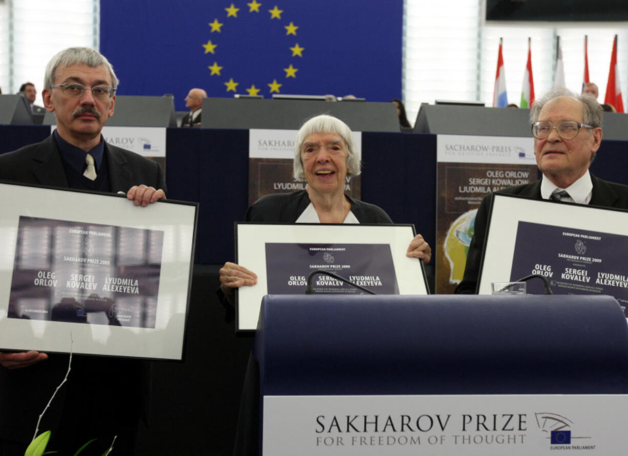 FILE - From left, Russia&rsquo;s Oleg Orlov, Lyudmila Alexeyeva and Sergei Kovalyov pose on Dec.16, 2009 in Strasbourg, France, at the European Parliament, as the Russian activists receive the European Union&rsquo;s top human rights award in recognition of the difficult conditions they face at home.