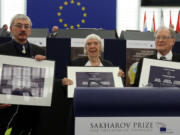 FILE - From left, Russia&rsquo;s Oleg Orlov, Lyudmila Alexeyeva and Sergei Kovalyov pose on Dec.16, 2009 in Strasbourg, France, at the European Parliament, as the Russian activists receive the European Union&rsquo;s top human rights award in recognition of the difficult conditions they face at home.