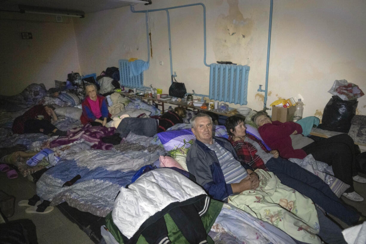 FILE - Residents shelter in a basement in the Kursk region town of Sudzha, Russia, on Aug. 16, 2024. This image was approved by the Ukrainian Defense Ministry before publication.