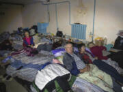 FILE - Residents shelter in a basement in the Kursk region town of Sudzha, Russia, on Aug. 16, 2024. This image was approved by the Ukrainian Defense Ministry before publication.