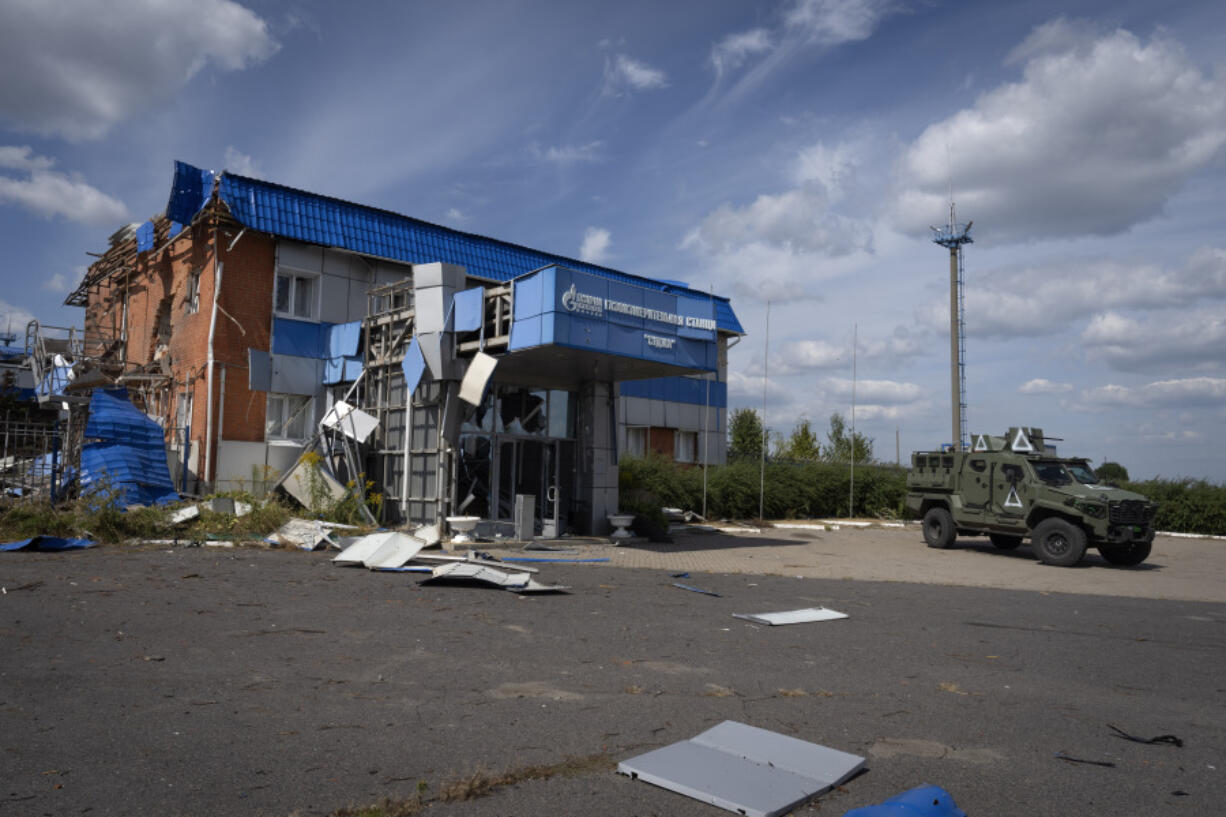 A Ukrainian army armored personnel carrier drives past a gas metering station of the Russian energy giant Gazprom in Sudzha, in Russia&rsquo;s Kursk region, on Friday.