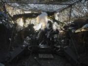 Ukrainian servicemen of 148th separate artillery brigade of the Air Assault Forces fire towards Russian positions by a M777 howitzer at the frontline in Donetsk region, Ukraine, Wednesday, August 21, 2024.