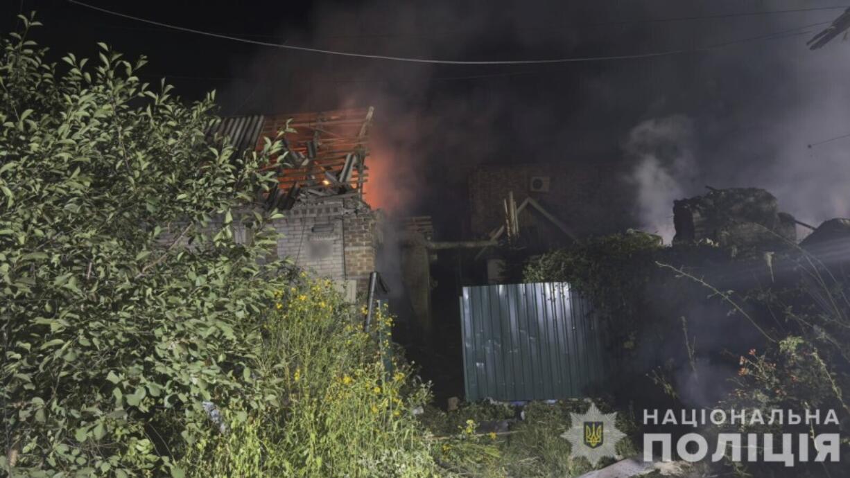 In this photo provided by the National Police of Ukraine on Tuesday, August 27, 2024, a residential house is seen on fire after Russian airstrike in Zaporizhzhia, Ukraine.