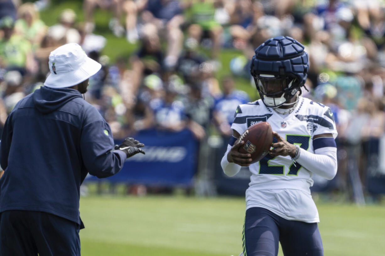 Seattle Seahawks defensive back Riq Woolen catches the ball during practice at NFL football training camp, Saturday, July 27, 2024, in Renton, Wash.