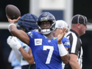 Seattle Seahawks quarterback Geno Smith (7) throws a pass during an NFL joint football training camp practice with the Tennessee Titans, Wednesday, Aug. 14, 2024, in Nashville, Tenn.