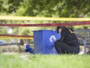 Police investigate the scene where dog walker Ruth Dalton, 80, was reported killed at Brighton Playfield, Tuesday, Aug. 20, 2024, in Seattle.