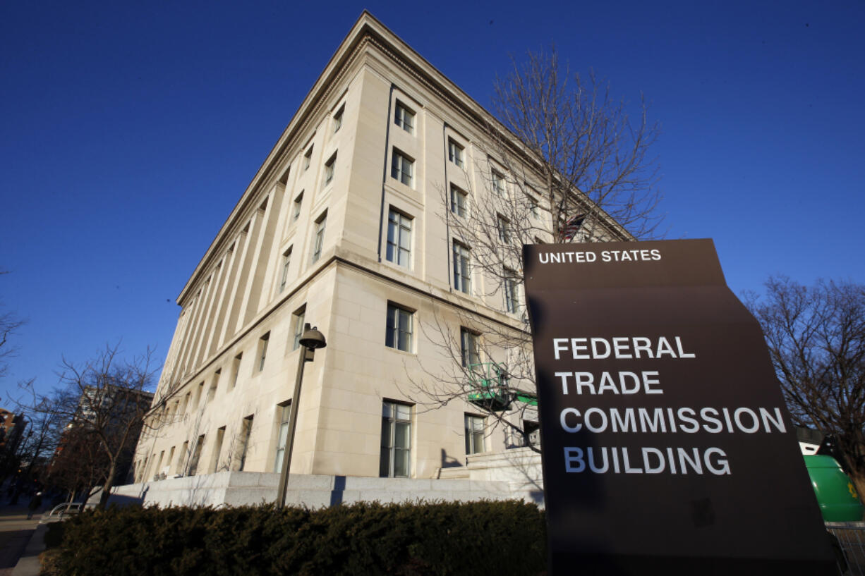 FILE - A sign stands outside the Federal Trade Commission building, Jan. 28, 2015, in Washington.