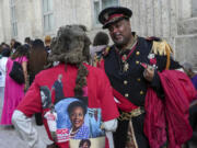 Ben Burns talks with a man named Motapa as they wait to pay their respects to the late Rep. Sheila Jackson Lee as she lies in state Monday, July 29, 2024, at Houston City Hall in Houston.